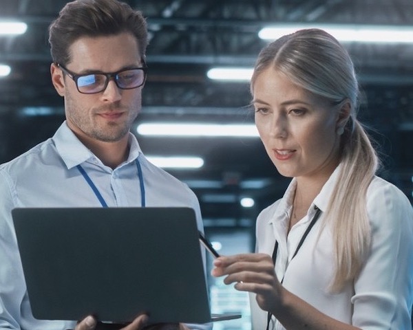 Two people looking at computer